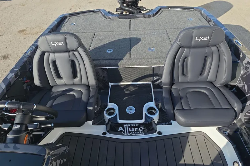Slide: The Image of 2025 iKon LX21 boat interior with dual seats and steering wheel. - 20