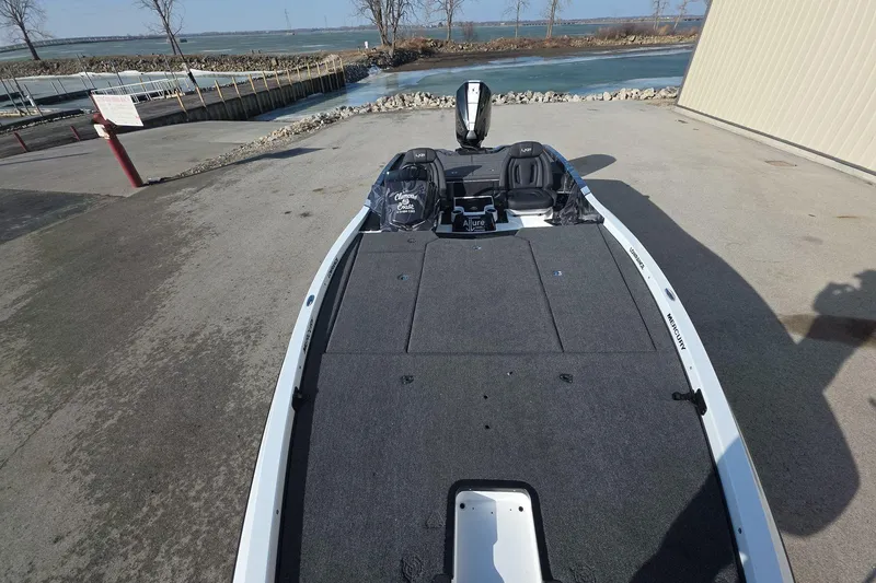 Slide: The Image of 2025 iKon LX21 boat at dock, featuring spacious deck and modern design. - 7