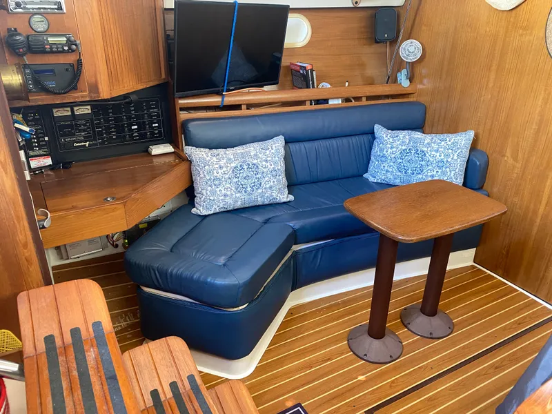 Slide: The Image of Interior of 2003 Catalina 350 sailboat with blue seating. - 14
