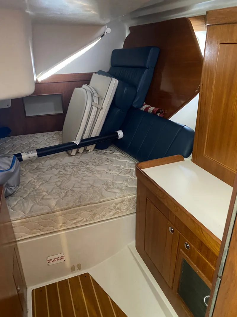 Slide: The Image of Interior of a 2003 Catalina 350 yacht with bed and storage. - 20