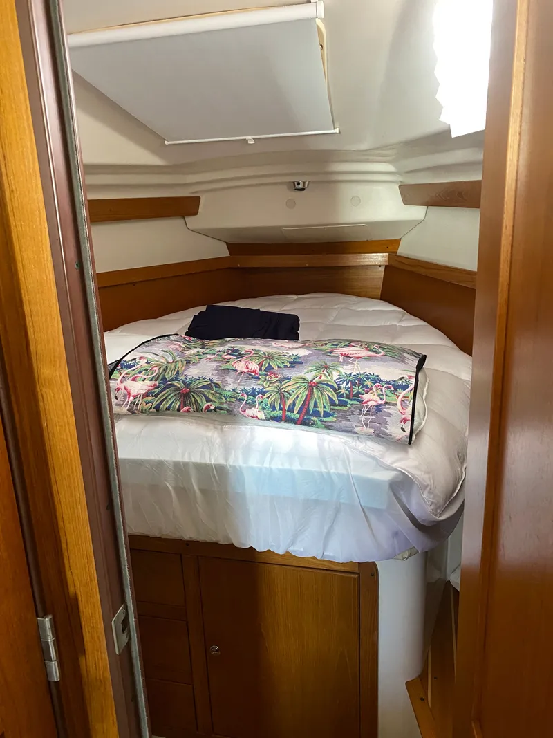 Slide: The Image of Interior of a 2003 Catalina 350 yacht with cozy bed. - 22
