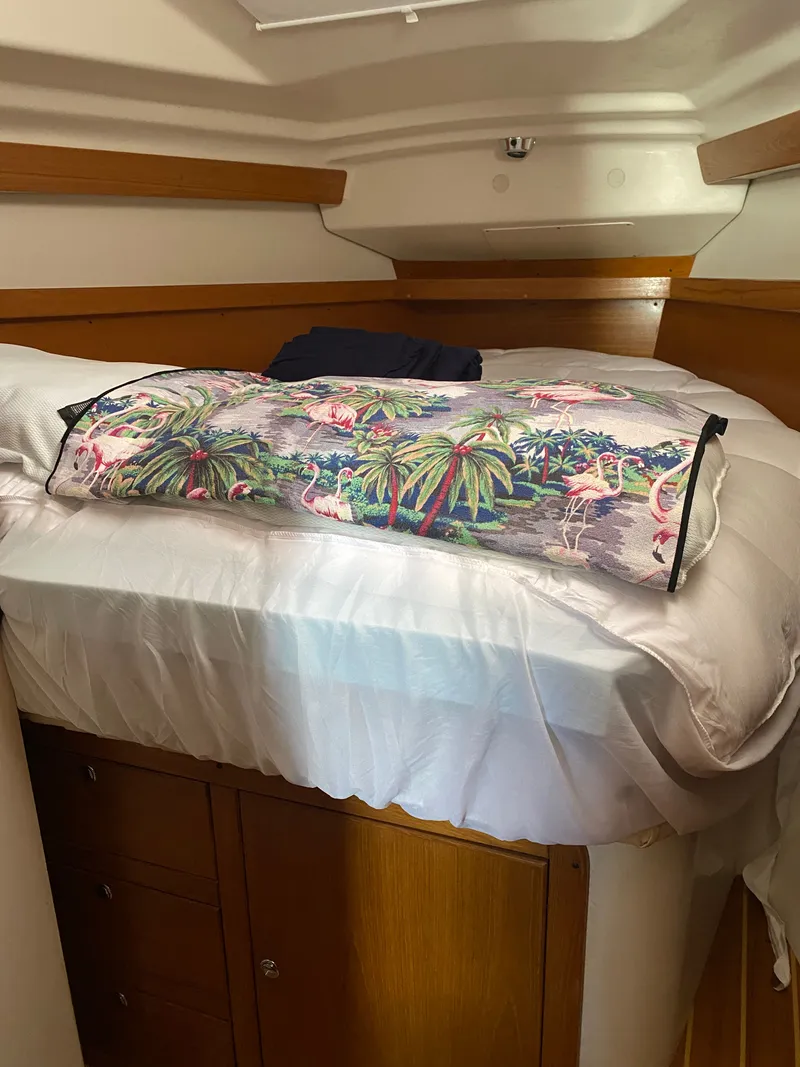 Slide: The Image of Interior of a Catalina 350 yacht with bed and tropical pillow. - 23