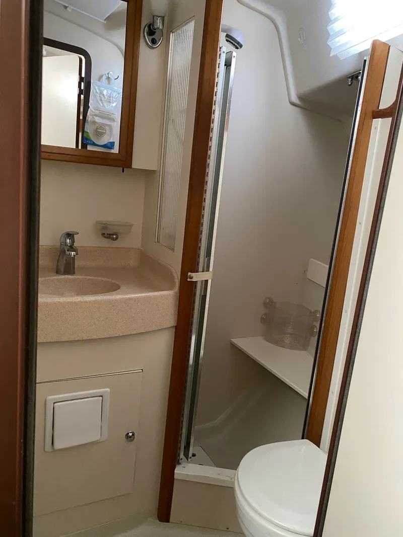 Slide: The Image of Bathroom of a 2003 Catalina 350 yacht with sink and toilet. - 25