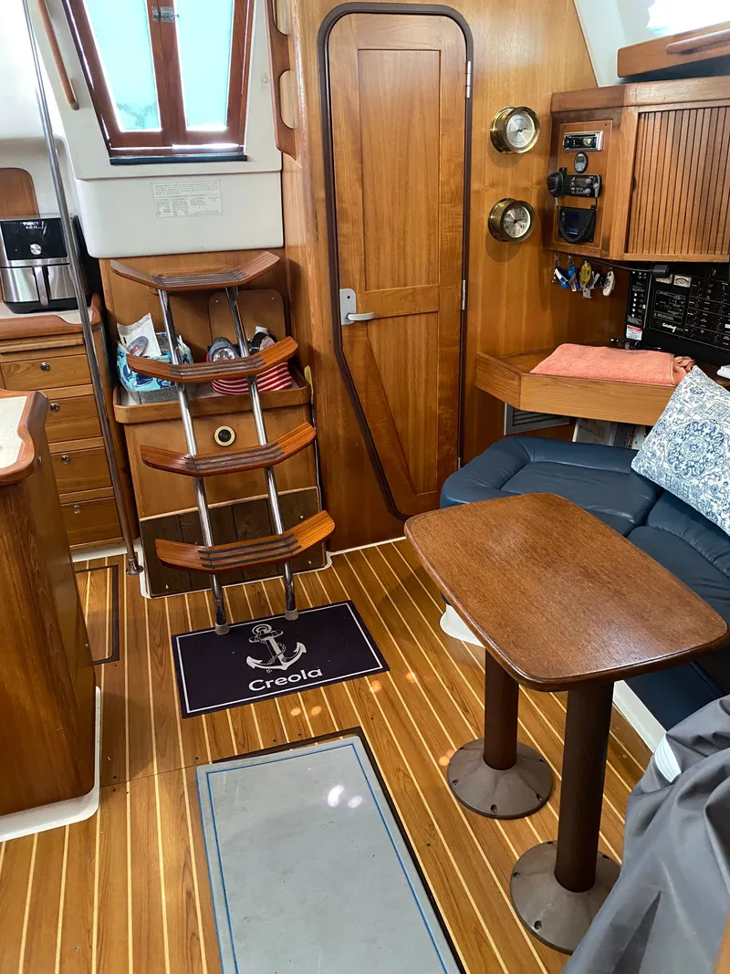 Slide: The Image of Interior of a 2003 Catalina 350 yacht with wooden furnishings. - 26