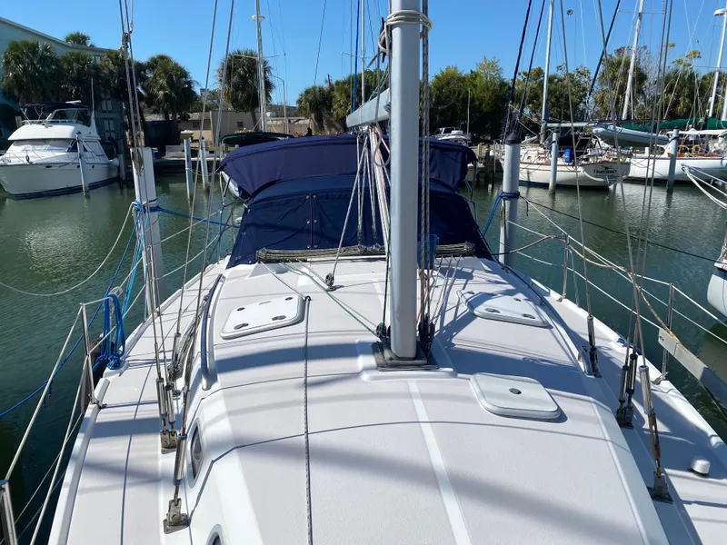 Slide: The Image of 2003 Catalina 350 sailboat docked in marina, sunny day. - 4