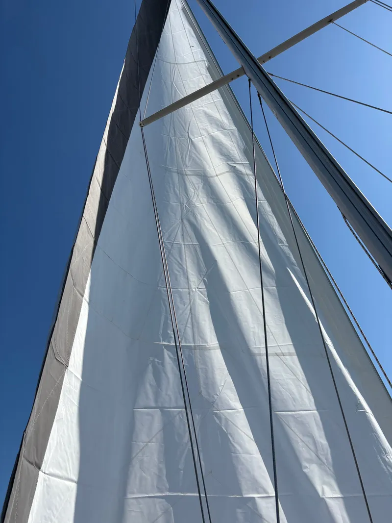 Slide: The Image of Sail of a 2003 Catalina 350 against blue sky. - 41