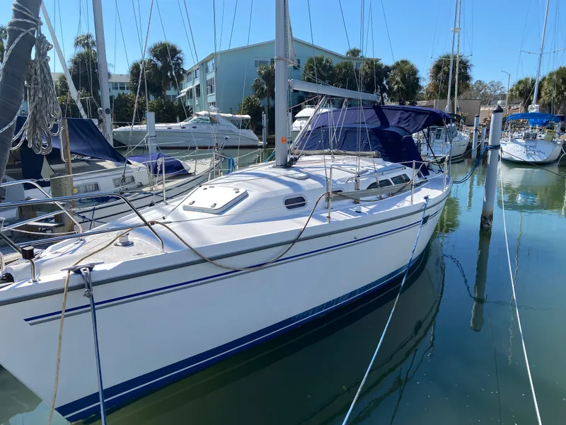 Slide: The Image of 2003 Catalina 350 sailboat docked in marina, sunny day. - 43
