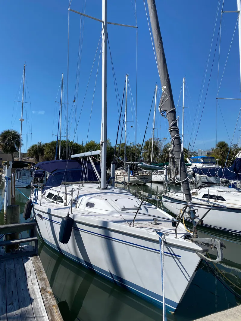 Slide: The Image of 2003 Catalina 350 sailboat docked in marina on a sunny day. - 44