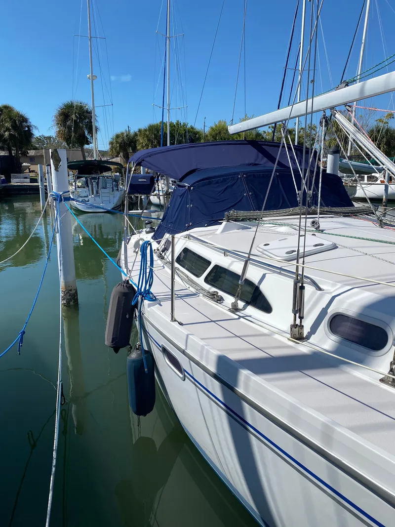 Slide: The Image of 2003 Catalina 350 sailboat docked in marina. - 45