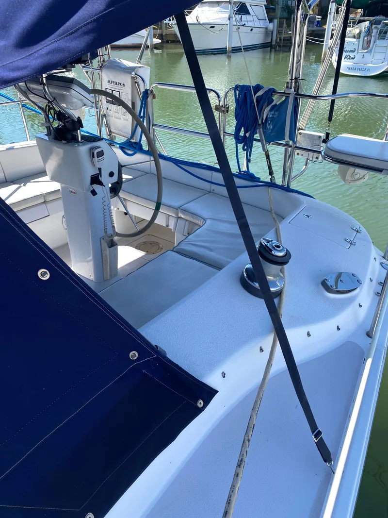 Slide: The Image of 2003 Catalina 350 sailboat cockpit with blue canopy. - 7