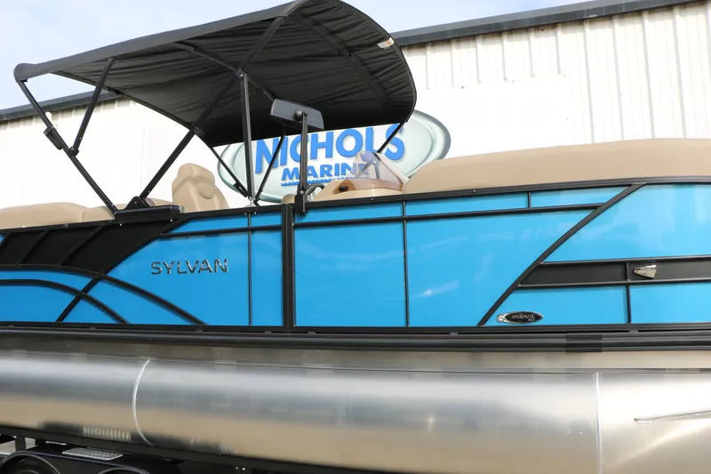 Slide: The Image of 2026 Sylvan Mirage 822 LZ pontoon boat with blue exterior and black canopy. - 11