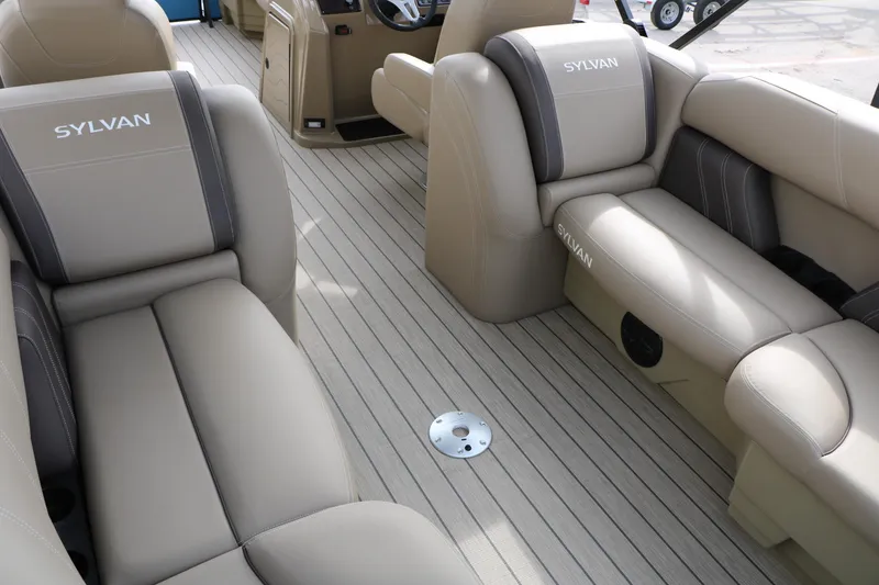 Slide: The Image of 2026 Sylvan Mirage 822 LZ interior with beige seating and sleek design. - 18