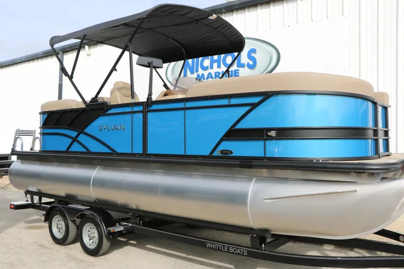 Slide: The Image of 2026 Sylvan Mirage 822 LZ pontoon boat in vibrant blue on trailer. - 2