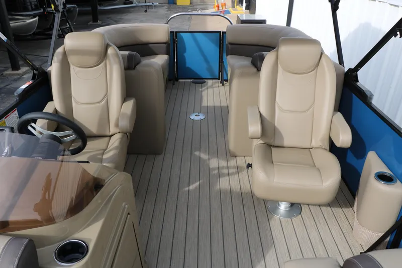 Slide: The Image of 2026 Sylvan Mirage 822 LZ pontoon boat interior with beige seating and modern design. - 28