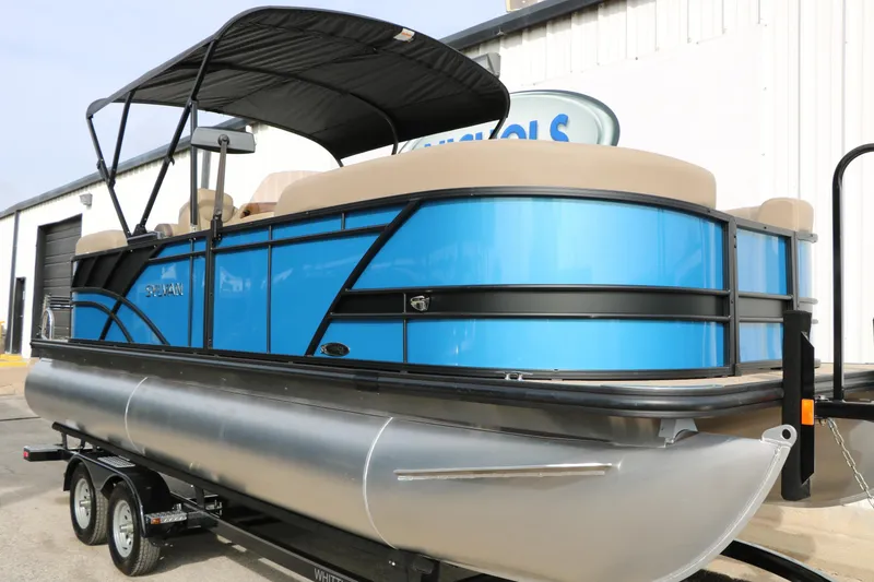 Slide: The Image of 2026 Sylvan Mirage 822 LZ pontoon boat with blue exterior on trailer. - 3
