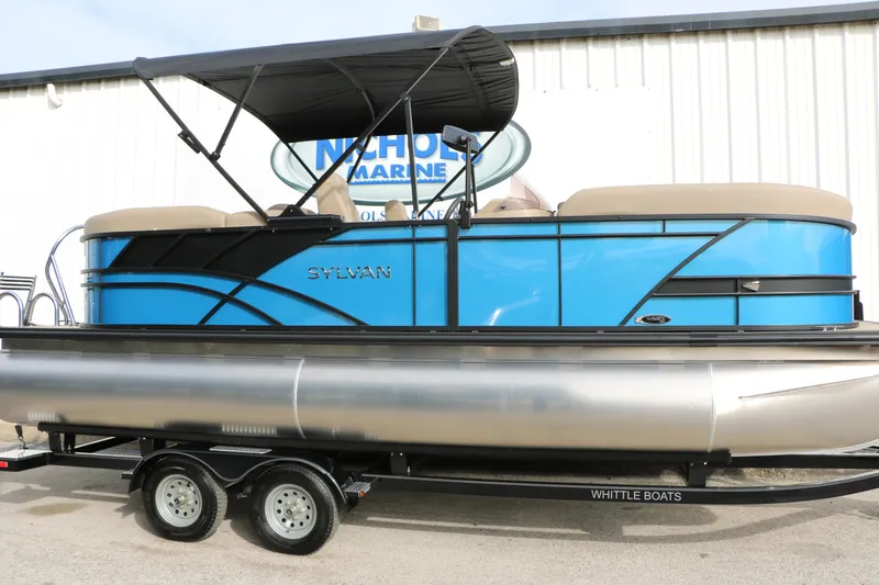 Slide: The Image of 2026 Sylvan Mirage 822 LZ pontoon boat with blue exterior and black canopy. - 9