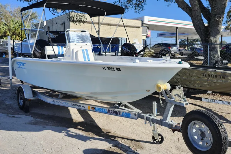 The Image of 2018 Glasstream 17 CCR boat on trailer, parked outdoors near a gas station. - 1