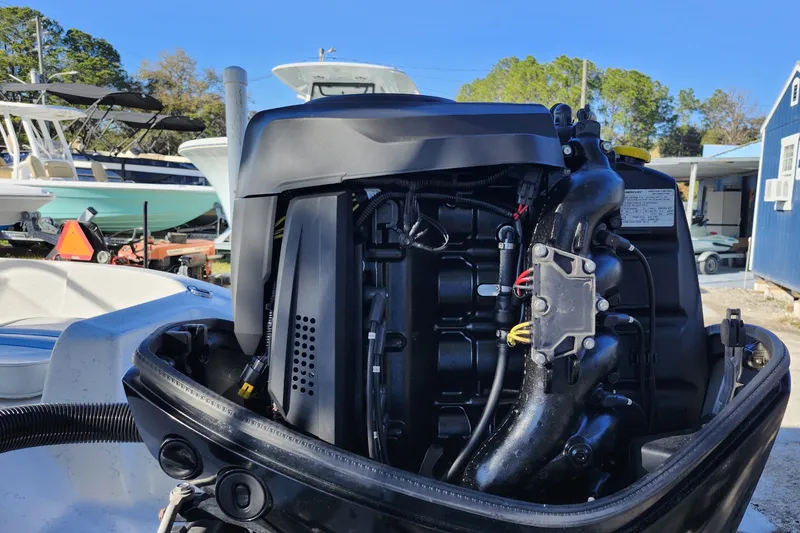 Slide: The Image of 2018 Glasstream 17 CCR boat engine, detailed view in a marina setting. - 10