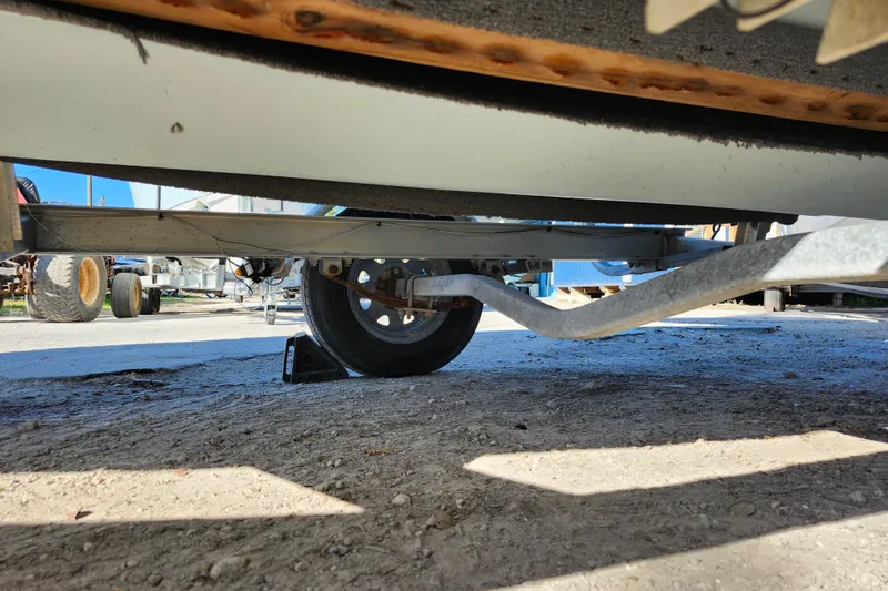 Slide: The Image of Underneath view of a 2018 Glasstream 17 CCR boat trailer on a sunny day. - 11
