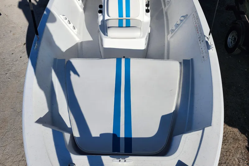 Slide: The Image of 2018 Glasstream 17 CCR boat interior with blue-striped seating. - 17