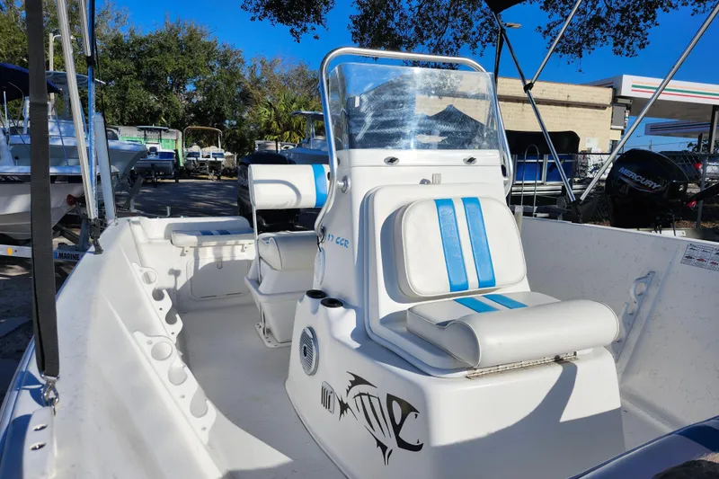 Slide: The Image of 2018 Glasstream 17 CCR boat with blue-striped seating, parked outdoors. - 20