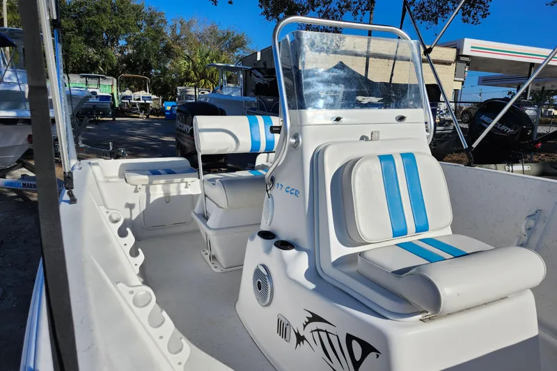 Slide: The Image of 2018 Glasstream 17 CCR boat interior with blue-striped seating and console. - 23