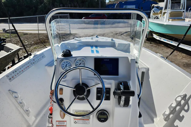 Slide: The Image of 2018 Glasstream 17 CCR boat dashboard with steering wheel and gauges. - 25