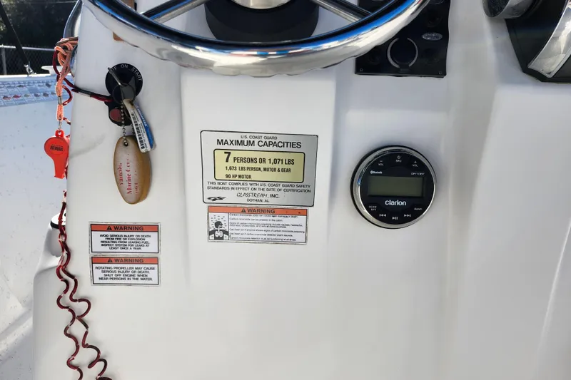 Slide: The Image of 2018 Glasstream 17 CCR boat dashboard with capacity label and Clarion audio system. - 26