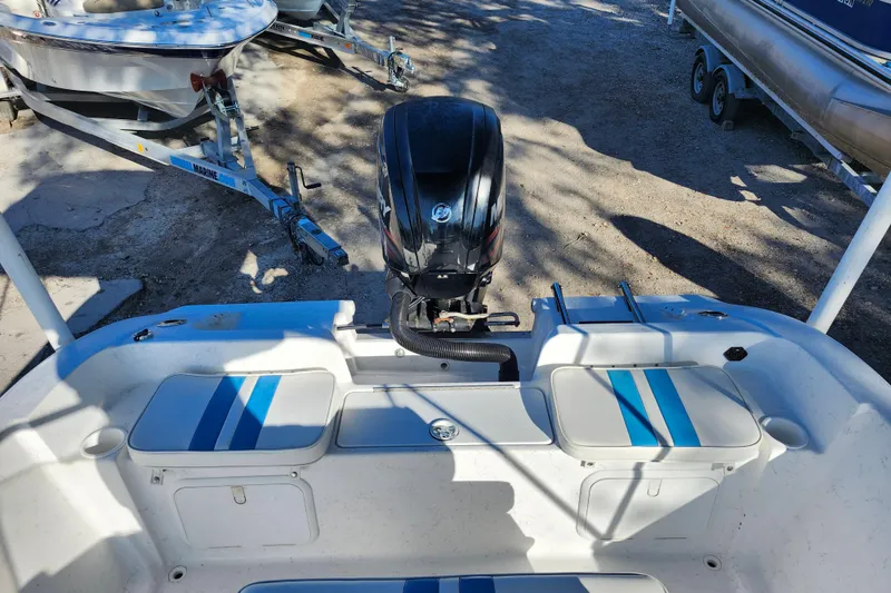 Slide: The Image of 2018 Glasstream 17 CCR boat with outboard motor and blue-striped seating. - 27