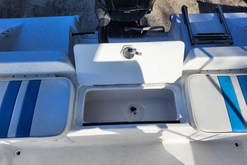 Slide: The Image of 2018 Glasstream 17 CCR boat interior with seating, storage, and motor. - 29