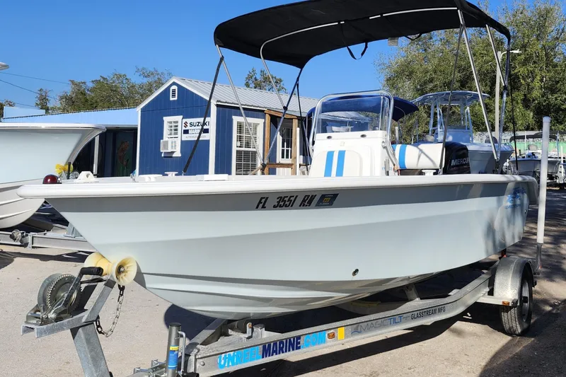 Slide: The Image of 2018 Glasstream 17 CCR boat on trailer, parked outdoors near marine shop. - 3