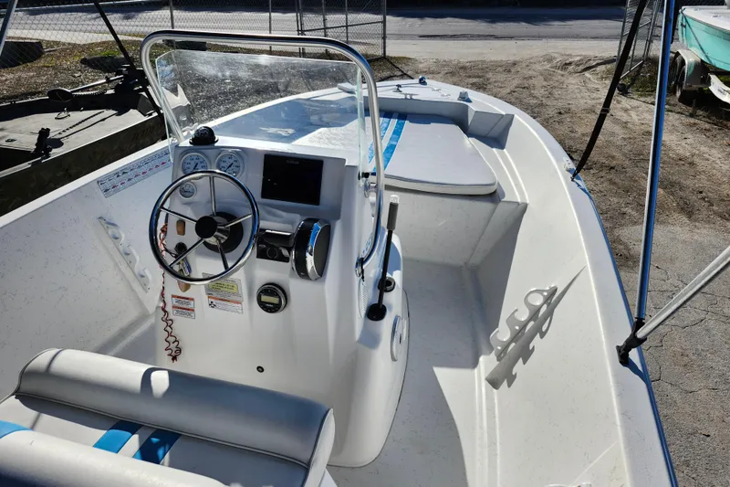 Slide: The Image of 2018 Glasstream 17 CCR boat interior with steering wheel and seating. - 34