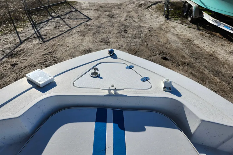 Slide: The Image of 2018 Glasstream 17 CCR boat bow with blue stripe, parked on dirt ground. - 36