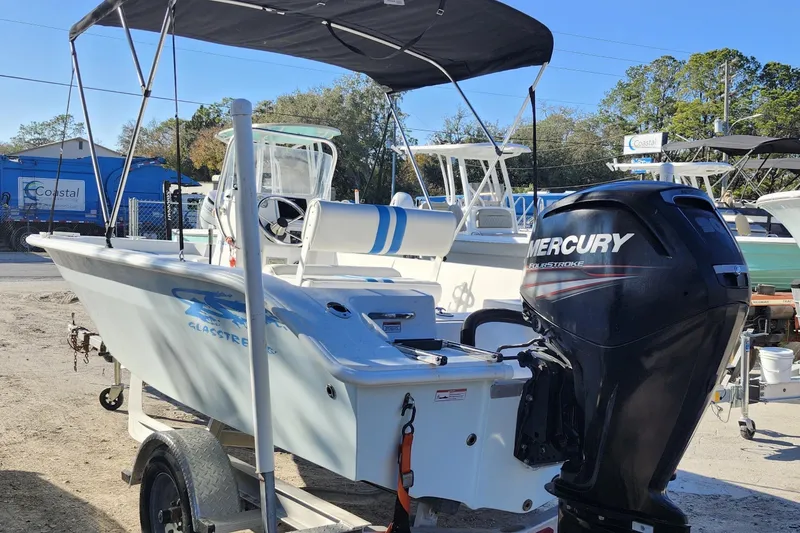 Slide: The Image of 2018 Glasstream 17 CCR boat with Mercury outboard motor, parked on a trailer. - 4