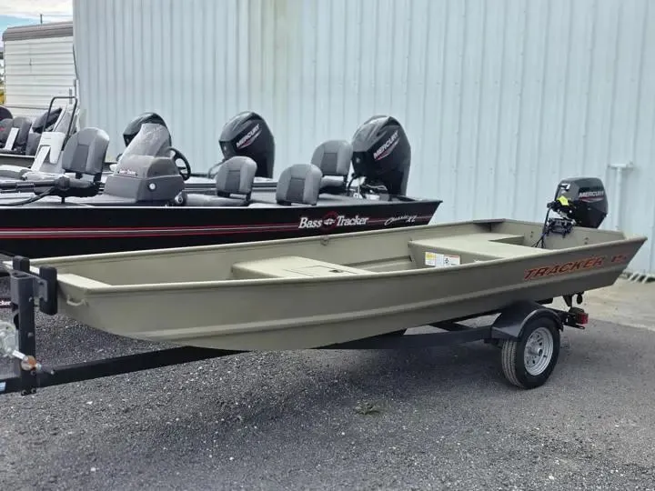 The Image of 2026 Tracker Grizzly 15 Jon boat on trailer, parked outdoors. - 1