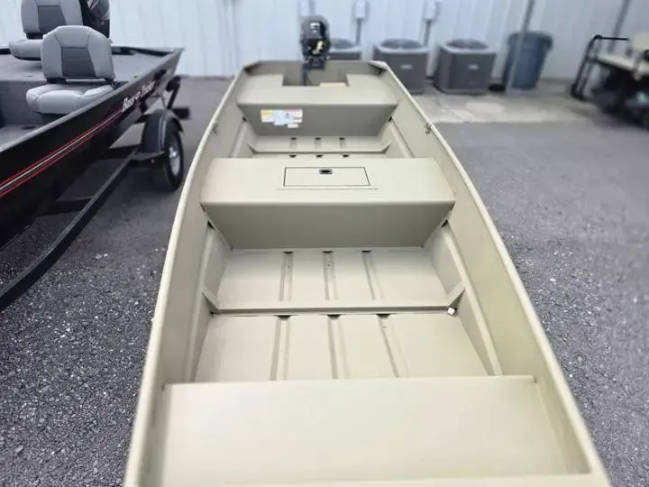 Slide: The Image of Tracker Grizzly 15 Jon boat, 2026 model, parked outdoors. - 8