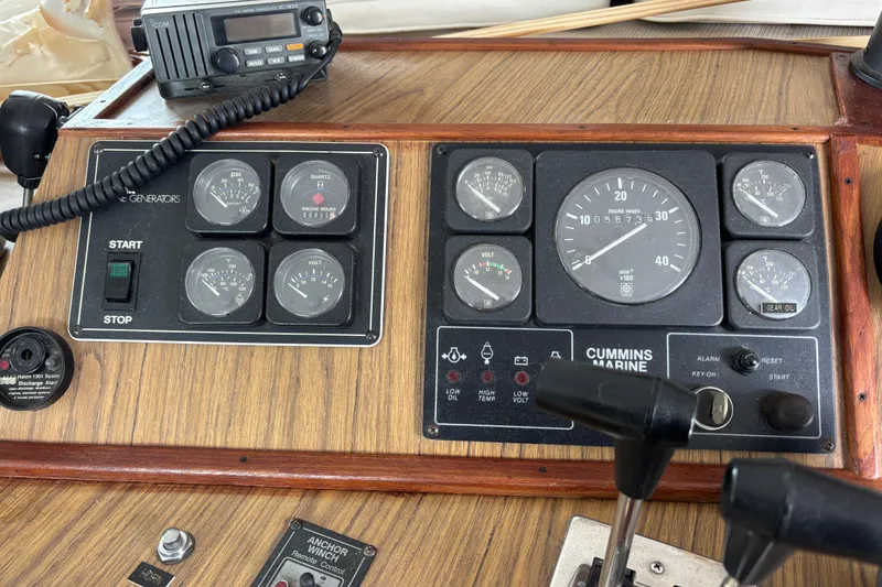 Slide: The Image of 1994 Harbor Master 52 Coastal Cruiser Lower Helm Station Engine Controls and gauges - 13