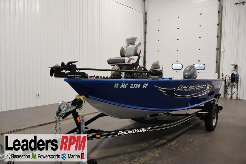 The Image of 2017 Polar Kraft Outlander 156 SC boat on trailer in indoor showroom. - 1