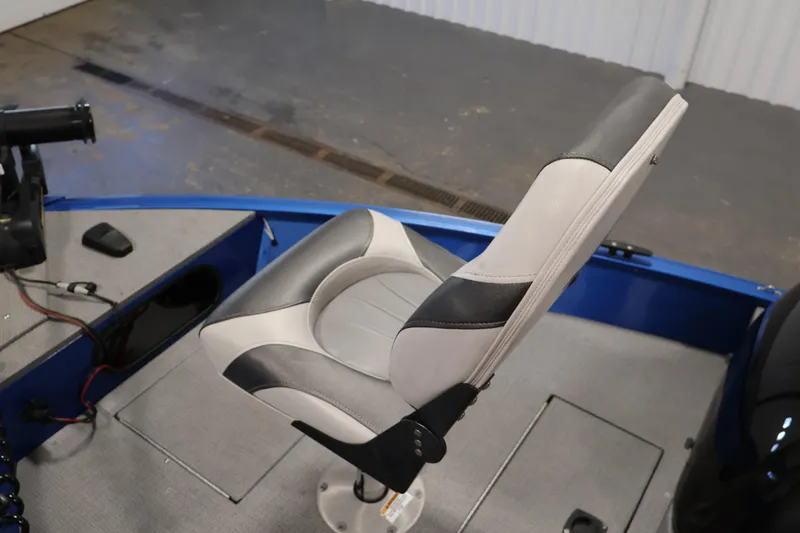 Slide: The Image of 2017 Polar Kraft Outlander 156 SC boat seat, gray and white upholstery, interior view. - 17