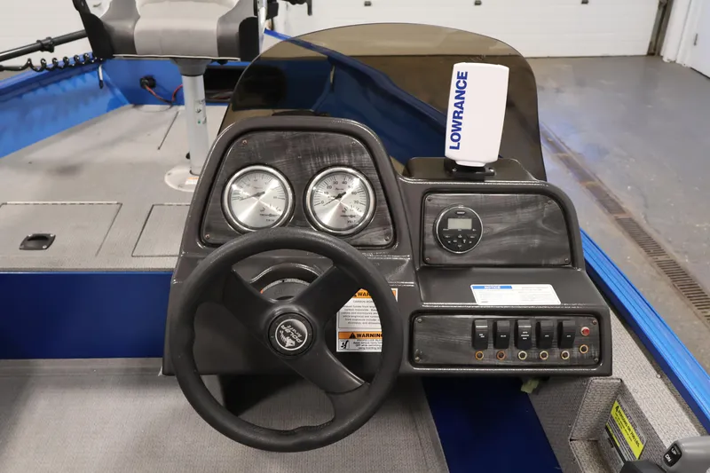 Slide: The Image of 2017 Polar Kraft Outlander 156 SC boat dashboard with steering wheel and gauges. - 20