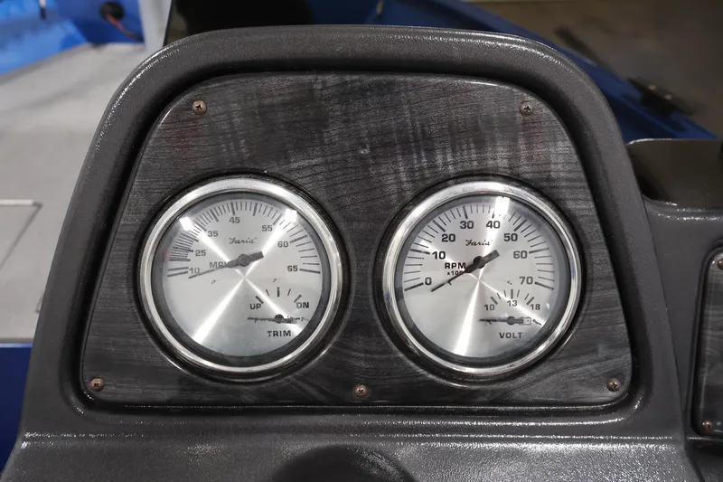 Slide: The Image of Dashboard gauges of 2017 Polar Kraft Outlander 156 SC boat, showing trim and volt meters. - 22