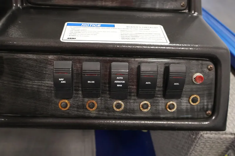 Slide: The Image of Control panel of a 2017 Polar Kraft Outlander 156 SC boat with labeled switches. - 25