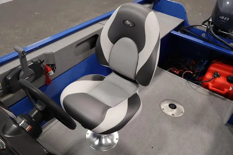 Slide: The Image of 2017 Polar Kraft Outlander 156 SC boat interior with steering wheel and seat. - 27