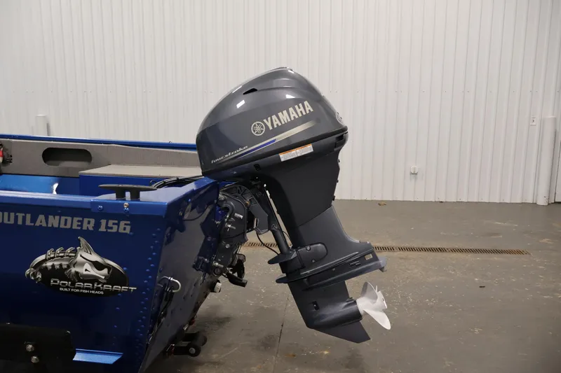Slide: The Image of 2017 Polar Kraft Outlander 156 SC boat with Yamaha outboard motor in a garage. - 30