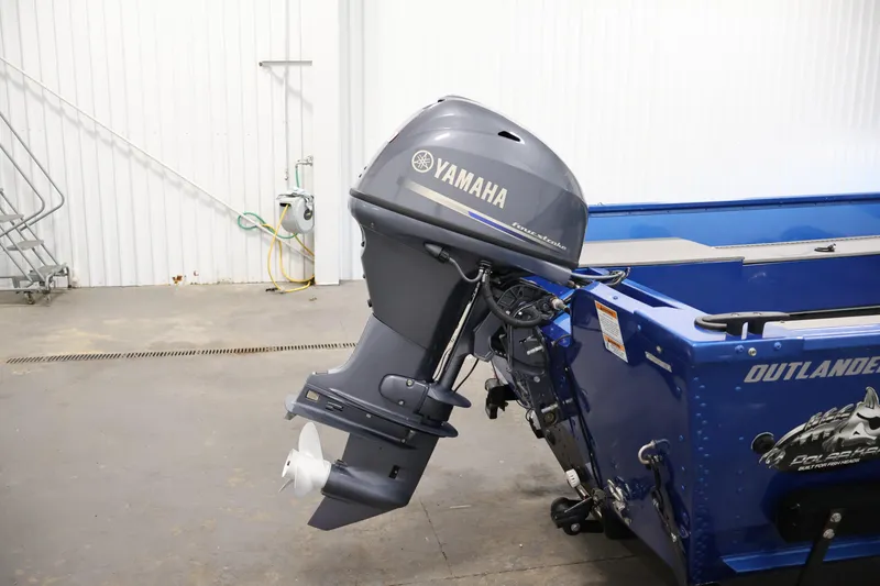 Slide: The Image of 2017 Polar Kraft Outlander 156 SC with Yamaha outboard motor in a garage setting. - 31