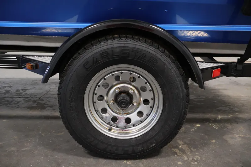 Slide: The Image of Trailer wheel of 2017 Polar Kraft Outlander 156 SC boat, featuring Carlstar tire. - 36