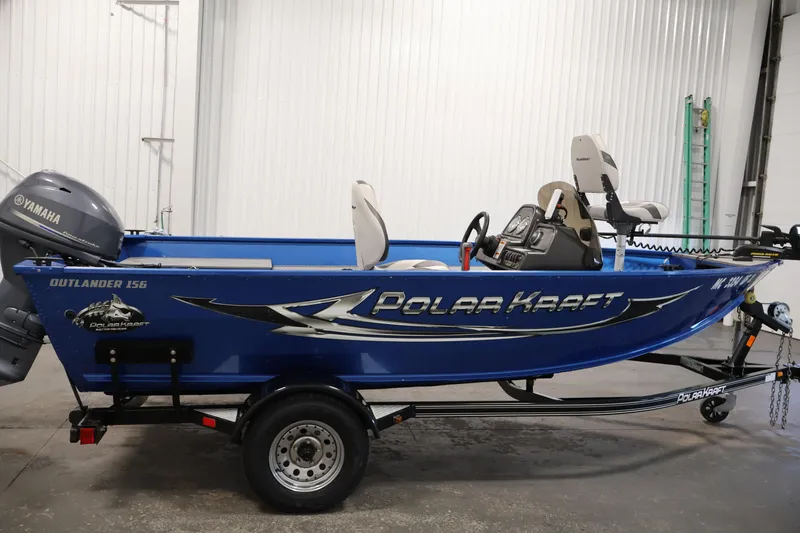 Slide: The Image of 2017 Polar Kraft Outlander 156 SC boat with Yamaha motor in a garage setting. - 4