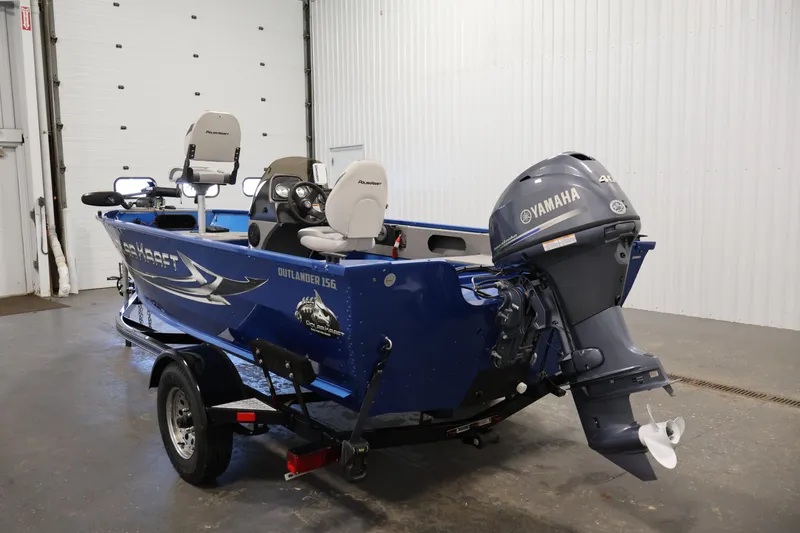 Slide: The Image of 2017 Polar Kraft Outlander 156 SC boat with Yamaha motor in a garage setting. - 7