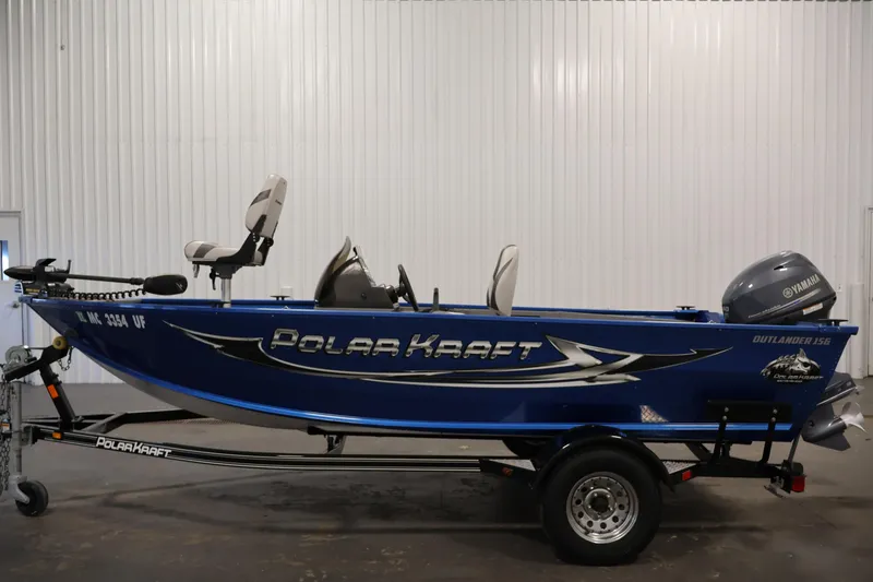 Slide: The Image of 2017 Polar Kraft Outlander 156 SC boat with Yamaha motor, blue exterior, on trailer. - 8