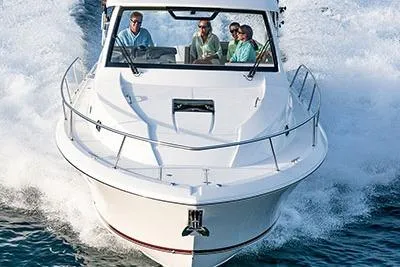 Slide: The Image of 2026 Pursuit OS 355 Offshore boat cruising with passengers on a sunny day. - 1